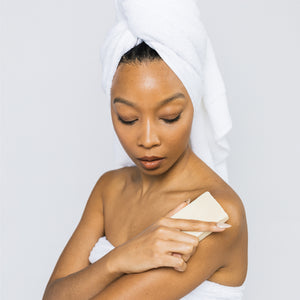 Model using Scrub & Butter Butter Bar on arms.