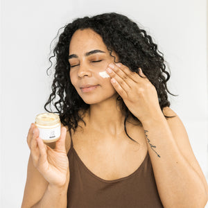 Model using Scrub & Butter Face Butter on her face.
