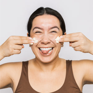 Model using Scrub & Butter Face Butter on her face.